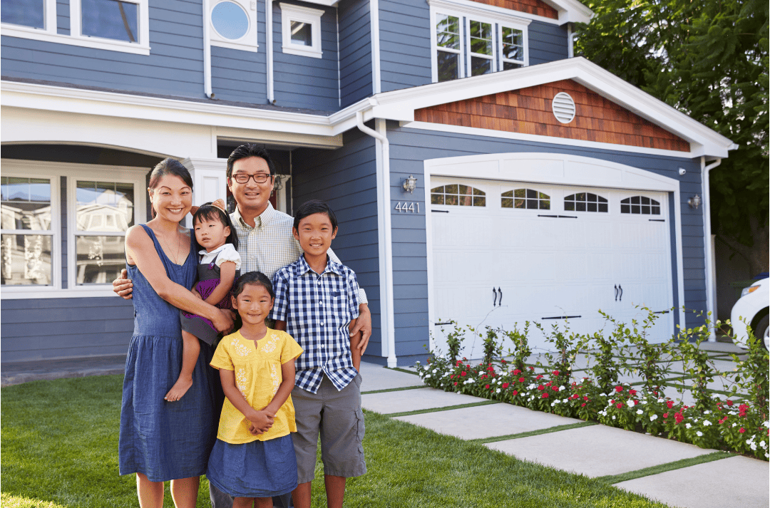 Do Ductless Mini Splits Increase Home Value? Family stand happy outside of their home. 